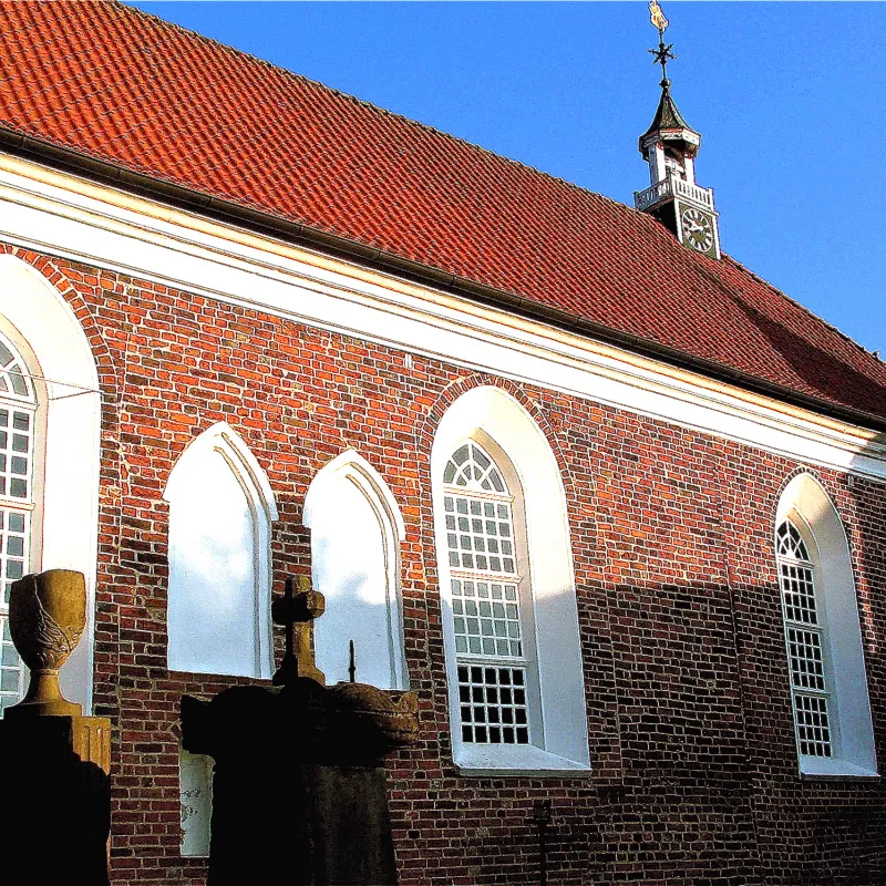 Greetsiel church from the outside, blue sky,